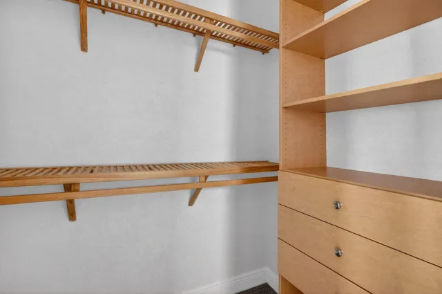 a view of a room with racks on the wall