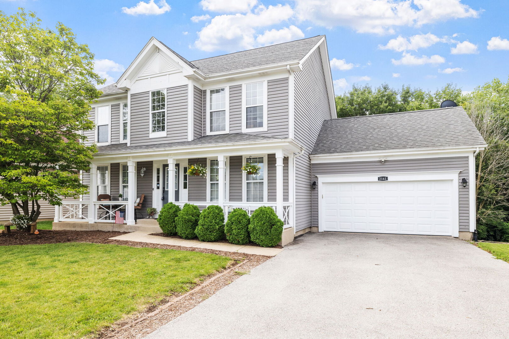 2161 Hammel Lane Aurora, IL 60504 - Photo 2 of 33 a front view of a house with a yard and garage
