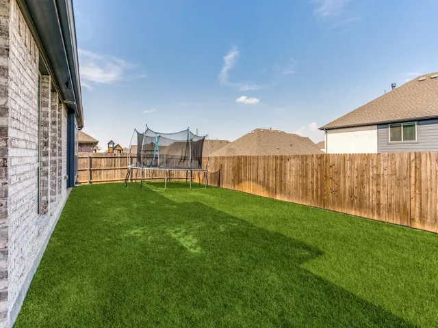 a view of a backyard with a garden and plants