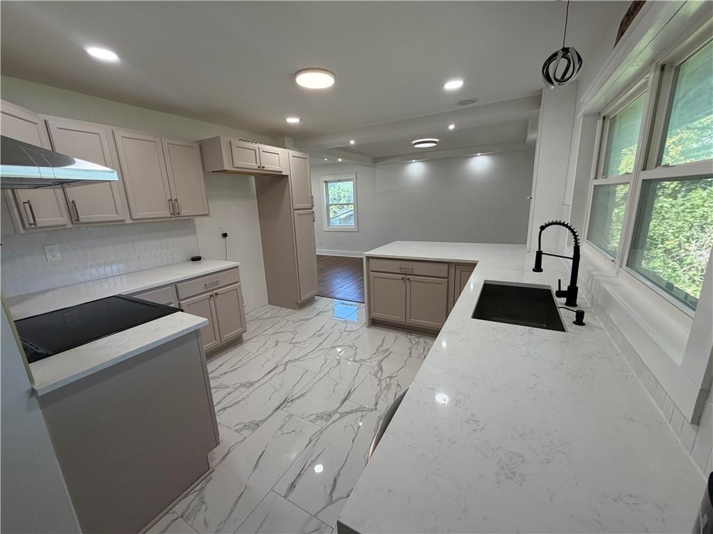 3763 Elkridge Drive Decatur, GA 30032 - Photo 4 of 20 a kitchen with stainless steel appliances a sink stove and cabinets