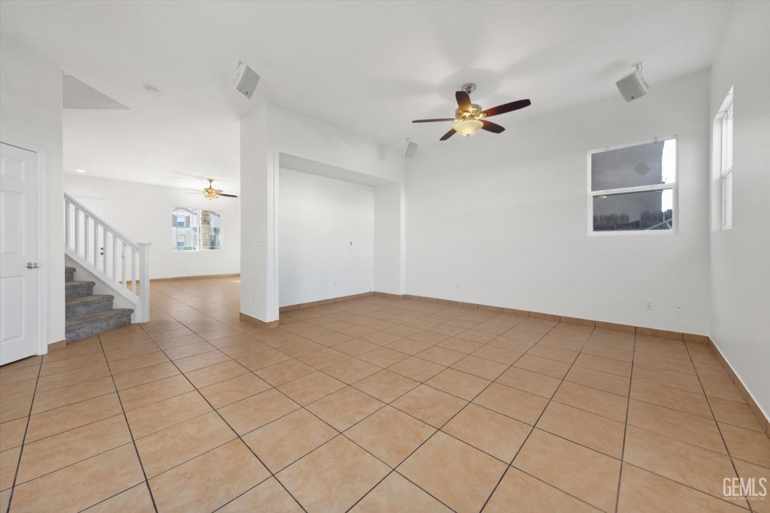 Undisclosed Address Bakersfield, CA 93313 - Photo 11 of 34 a view of an empty room and chandelier fan