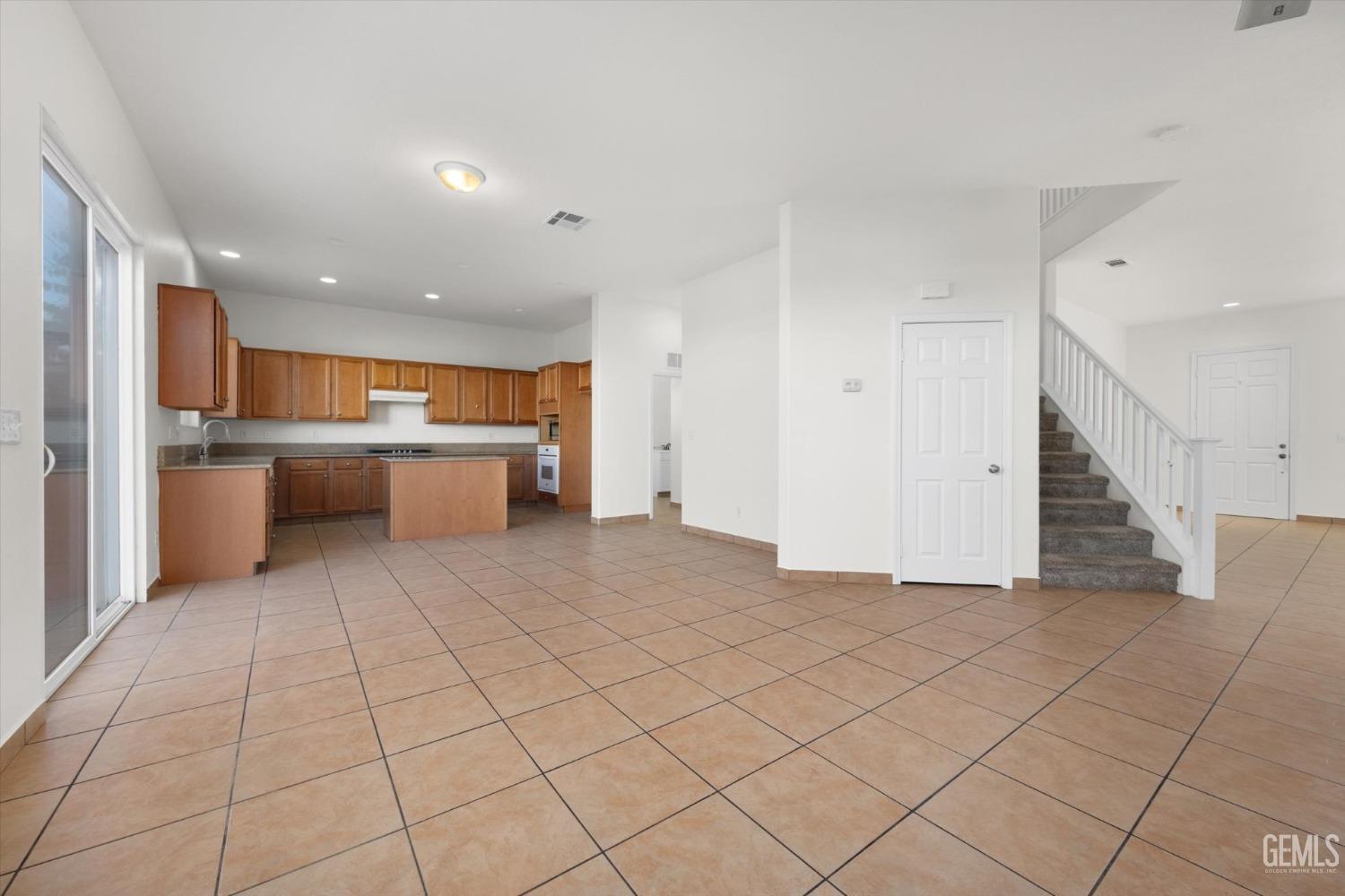 Undisclosed Address Bakersfield, CA 93313 - Photo 13 of 34 a view of a kitchen with a sink and an empty room