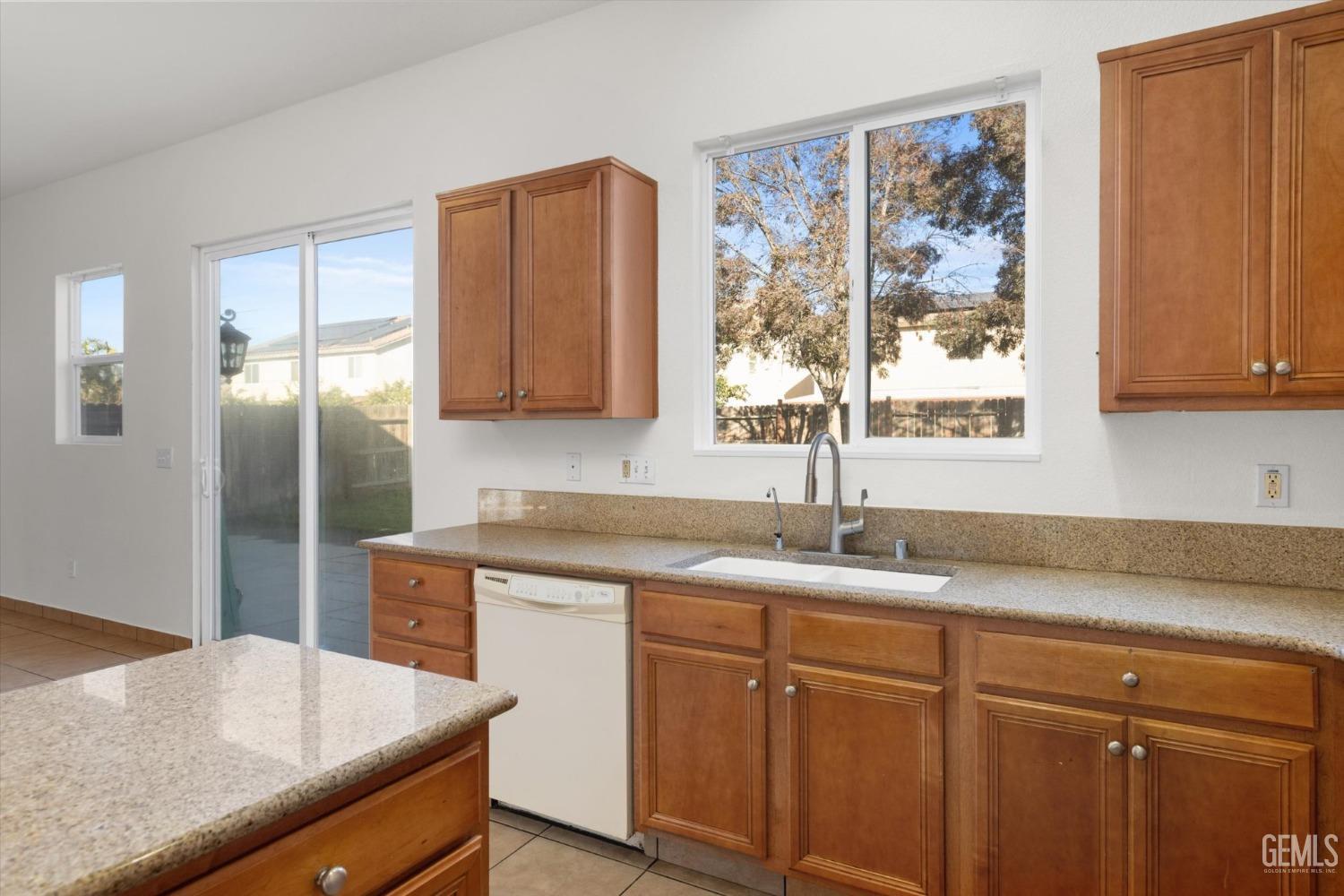 Undisclosed Address Bakersfield, CA 93313 - Photo 17 of 34 a kitchen with stainless steel appliances granite countertop a sink and a cabinets
