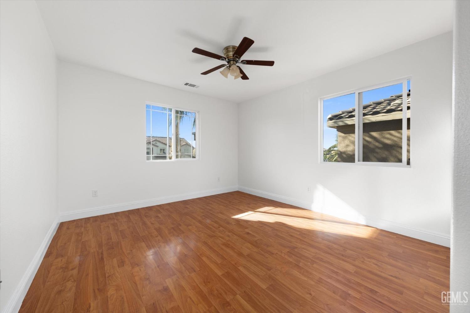 Undisclosed Address Bakersfield, CA 93313 - Photo 26 of 34 a view of empty room with wooden floor