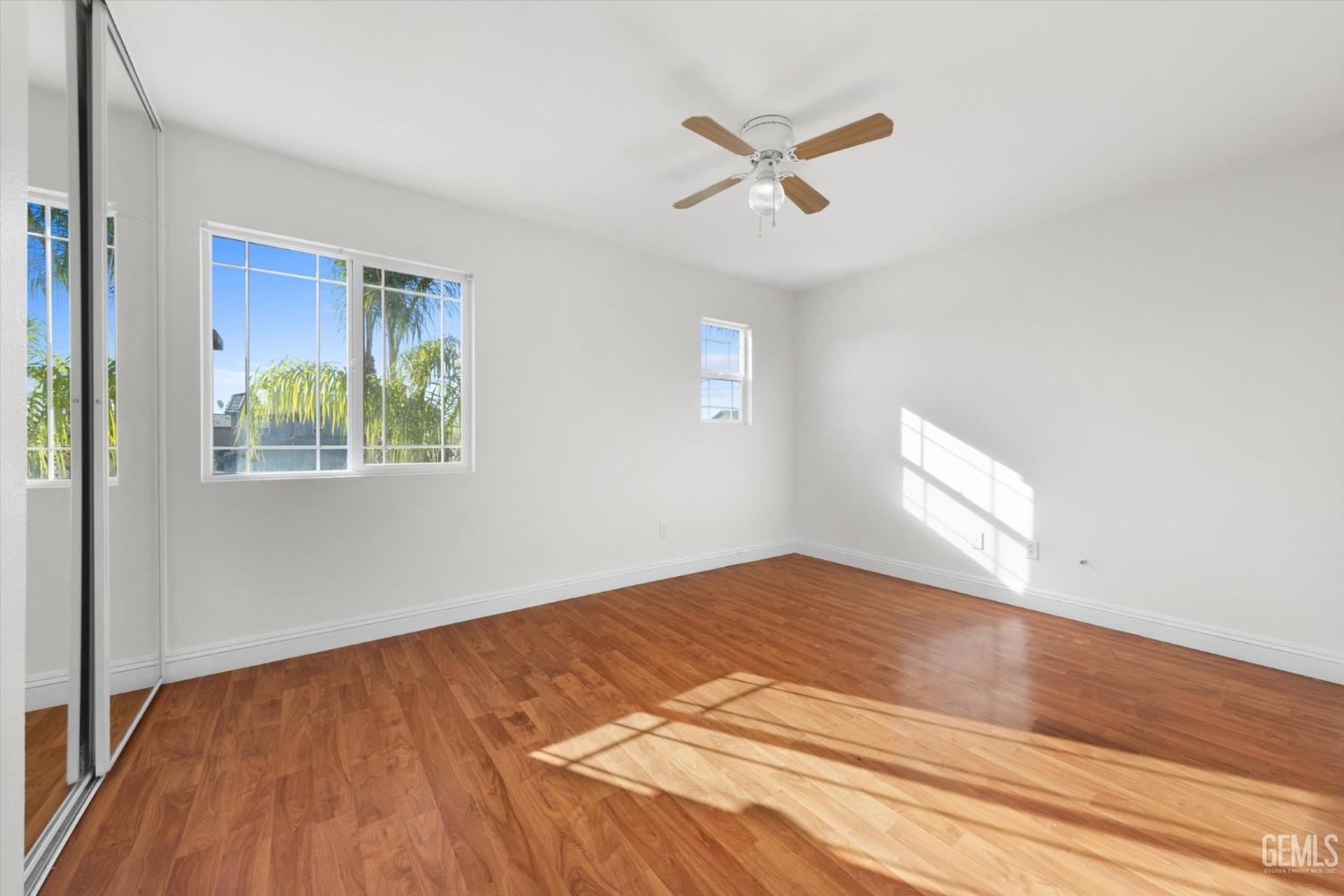 Undisclosed Address Bakersfield, CA 93313 - Photo 28 of 34 a view of empty room with wooden floor and fan