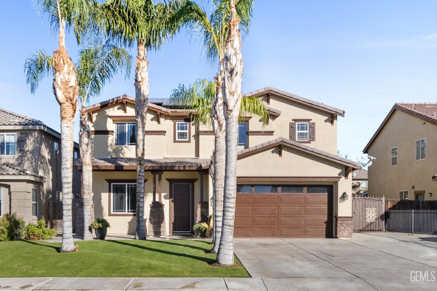 Undisclosed Address Bakersfield, CA 93313 - Photo 4 of 34 a front view of a house with garden