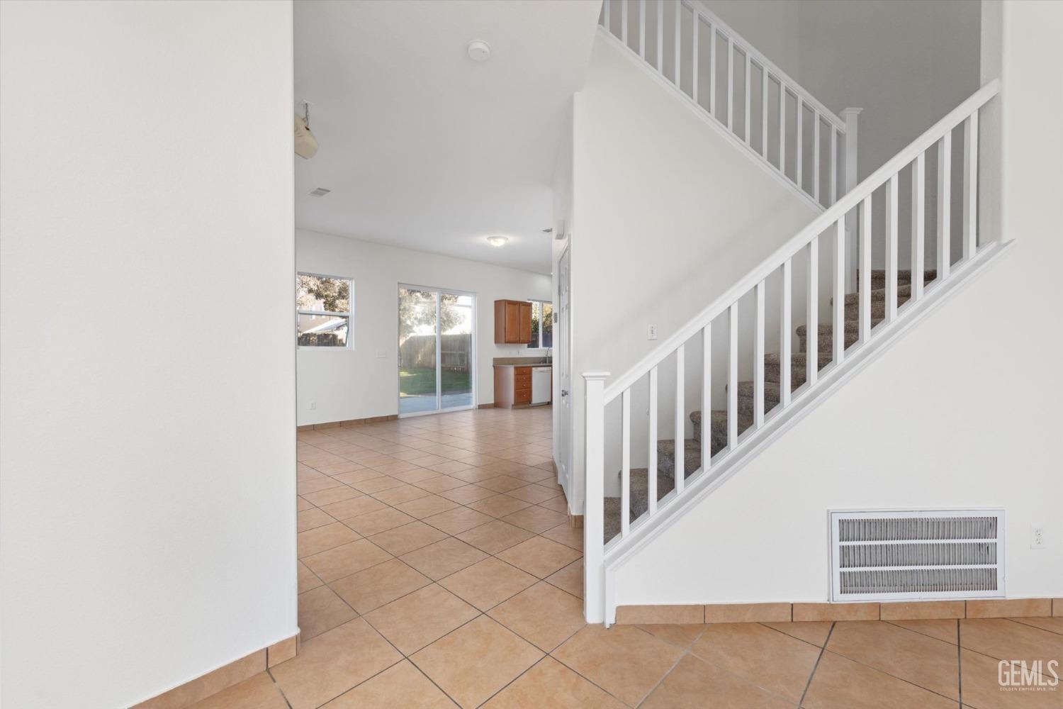 Undisclosed Address Bakersfield, CA 93313 - Photo 8 of 34 a view of staircase with white walls and a black white checkered floor