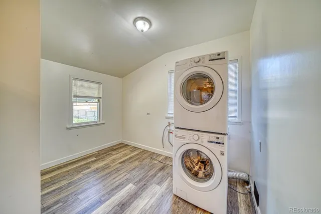 a utility room with sink dryer and washer