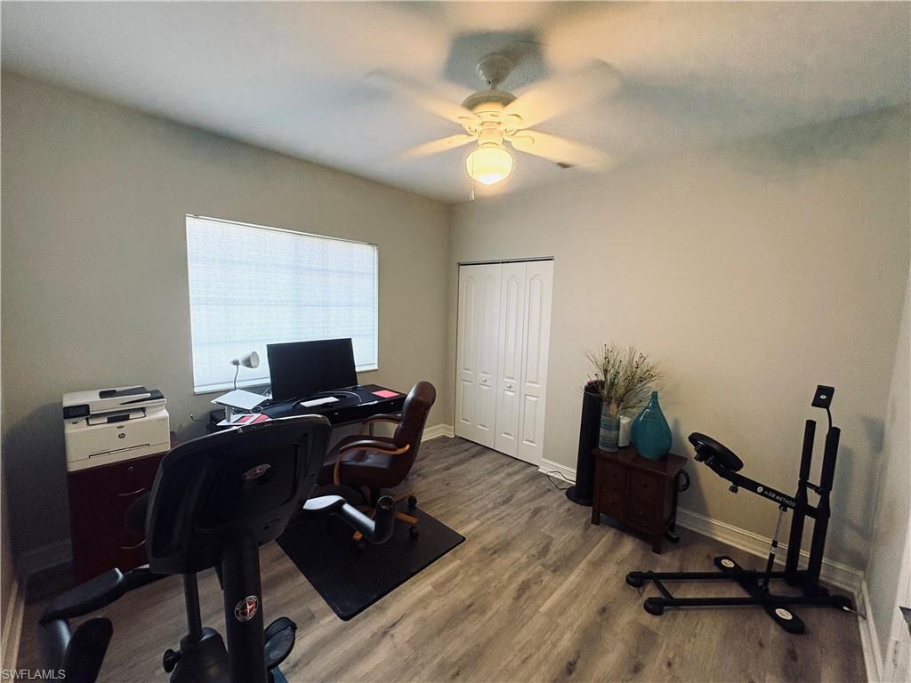 685 Luisa Lane, Unit 4 Naples, FL 34104 - Photo 12 of 25 a view of a workspace with furniture and a window