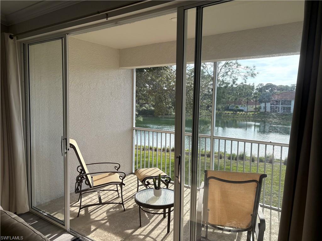 685 Luisa Lane, Unit 4 Naples, FL 34104 - Photo 25 of 25 a view of a dining room with furniture window and outside view