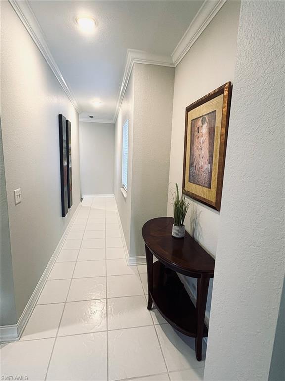 685 Luisa Lane, Unit 4 Naples, FL 34104 - Photo 4 of 25 a room with gym equipment and a mirror