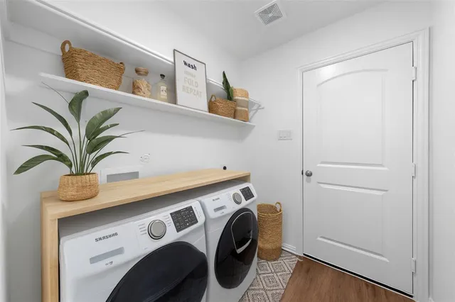 a utility room with dryer and washer