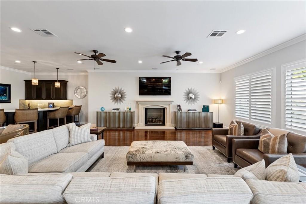 2510 Belleview Road Upland, CA 91784 - Photo 13 of 59 a living room with furniture a fireplace and a flat screen tv