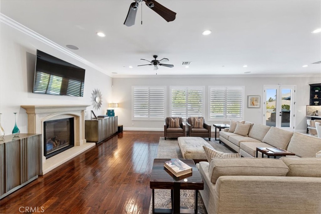 2510 Belleview Road Upland, CA 91784 - Photo 15 of 59 a living room with furniture flat screen tv and a fireplace