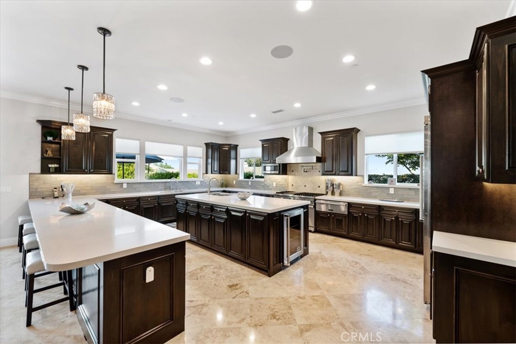 2510 Belleview Road Upland, CA 91784 - Photo 18 of 59 a kitchen with stainless steel appliances granite countertop a table and chairs in it