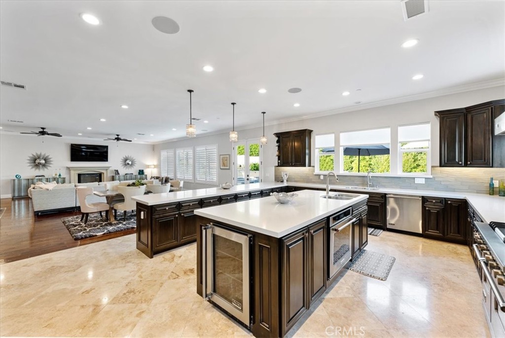 2510 Belleview Road Upland, CA 91784 - Photo 20 of 59 a kitchen with a stove a counter top space a sink cabinets and a view of kitchen