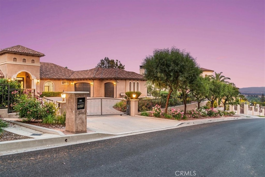 2510 Belleview Road Upland, CA 91784 - Photo 2 of 59 a front view of a house with a yard and a garage