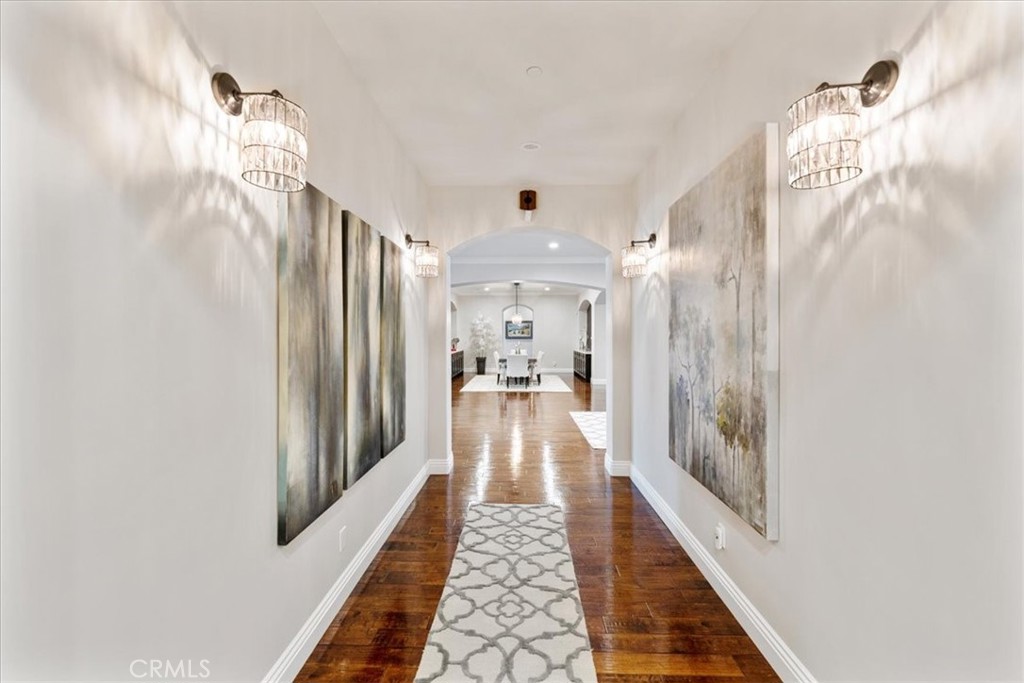 2510 Belleview Road Upland, CA 91784 - Photo 23 of 59 a view of a hallway with wooden floor and staircase