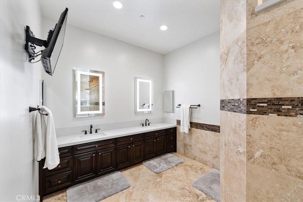 2510 Belleview Road Upland, CA 91784 - Photo 30 of 59 a spacious bathroom with a sink a mirror and shower