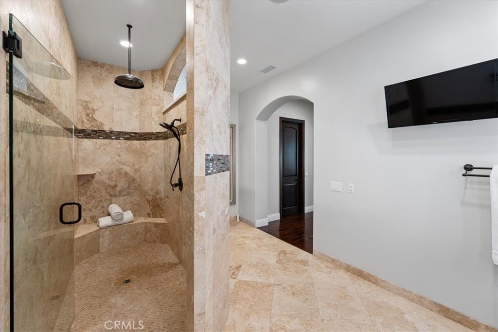 2510 Belleview Road Upland, CA 91784 - Photo 31 of 59 a bathroom with a shower and a mirror