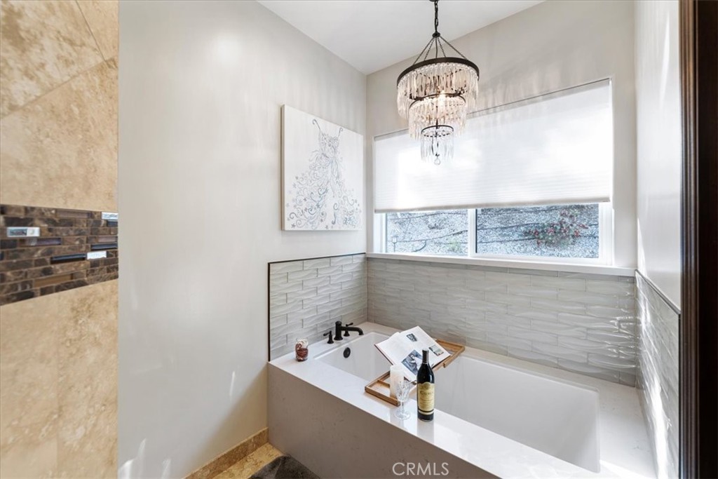 2510 Belleview Road Upland, CA 91784 - Photo 32 of 59 a bathroom with a bathtub and shower