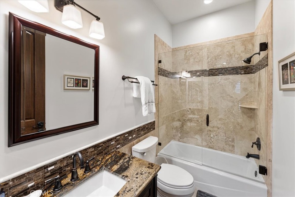 2510 Belleview Road Upland, CA 91784 - Photo 38 of 59 a bathroom with a bathtub shower sink vanity and toilet