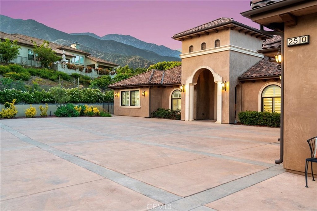 2510 Belleview Road Upland, CA 91784 - Photo 4 of 59 a view of a house with a yard and potted plants