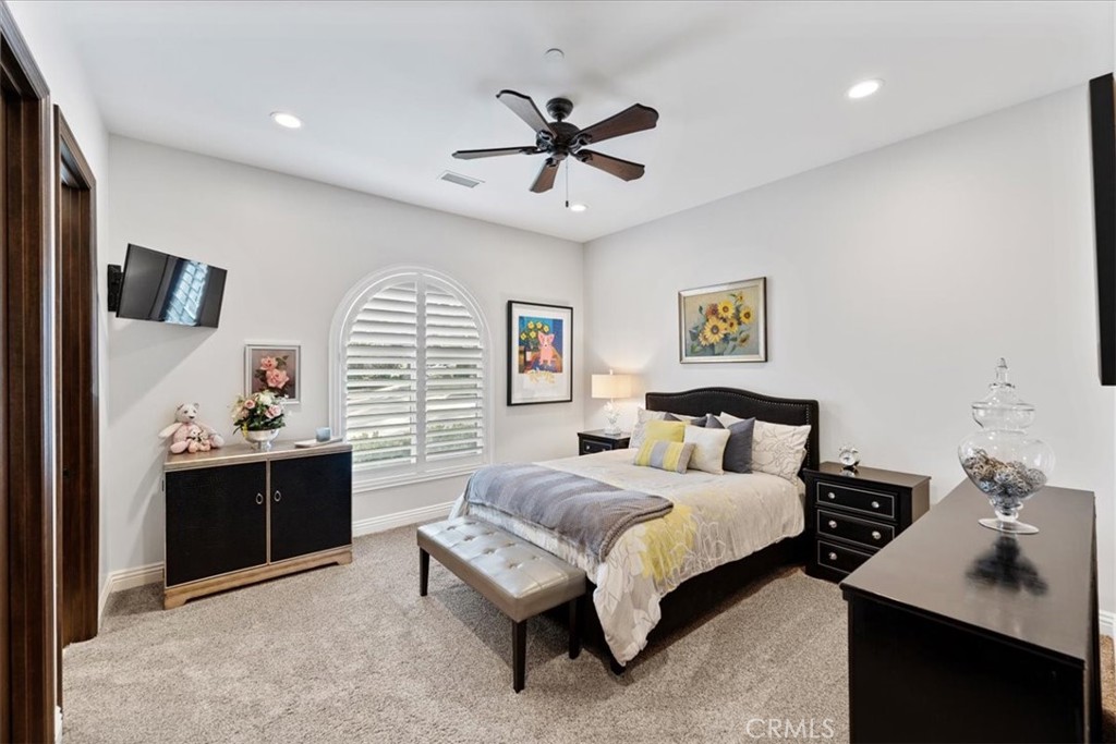 2510 Belleview Road Upland, CA 91784 - Photo 41 of 59 a bedroom with a bed and a chandelier