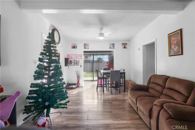 a living room with furniture and a christmas tree