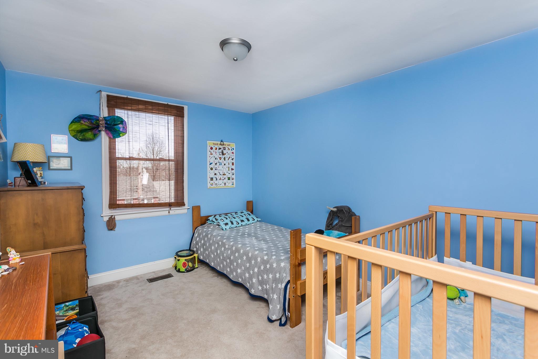 902 Andover Road Baltimore, MD 21218 - Photo 11 of 30 a bedroom with furniture and a window