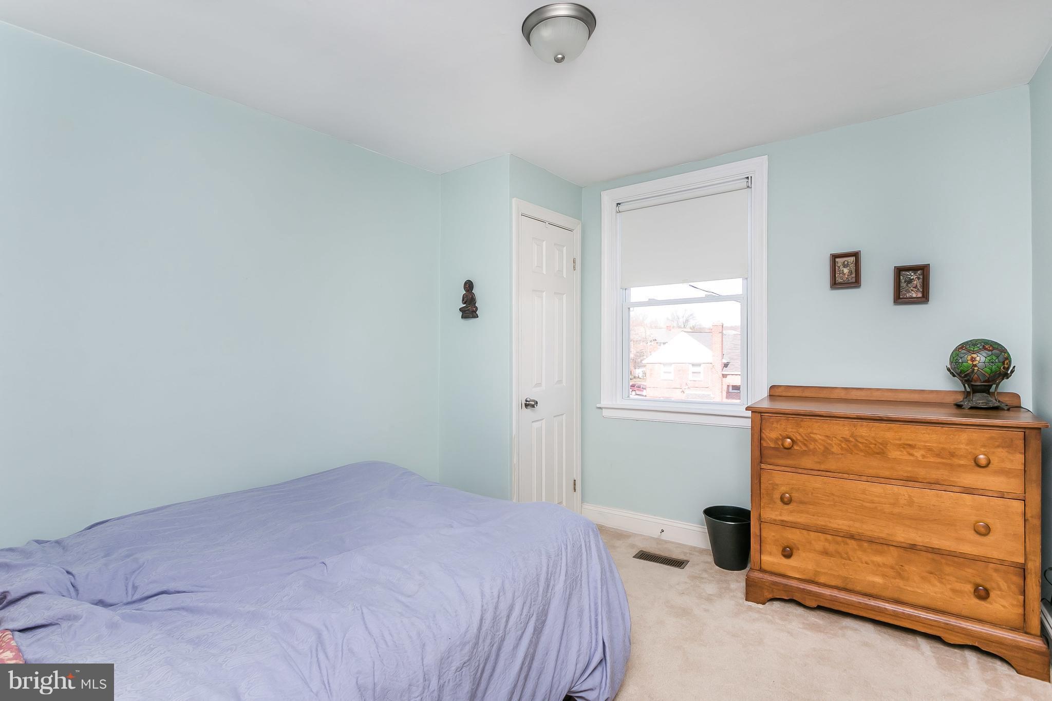 902 Andover Road Baltimore, MD 21218 - Photo 13 of 30 a bedroom with a bed and a dresser