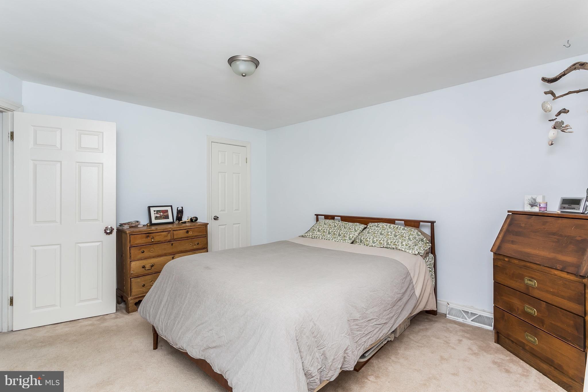 902 Andover Road Baltimore, MD 21218 - Photo 16 of 30 a bedroom with a bed and a closet