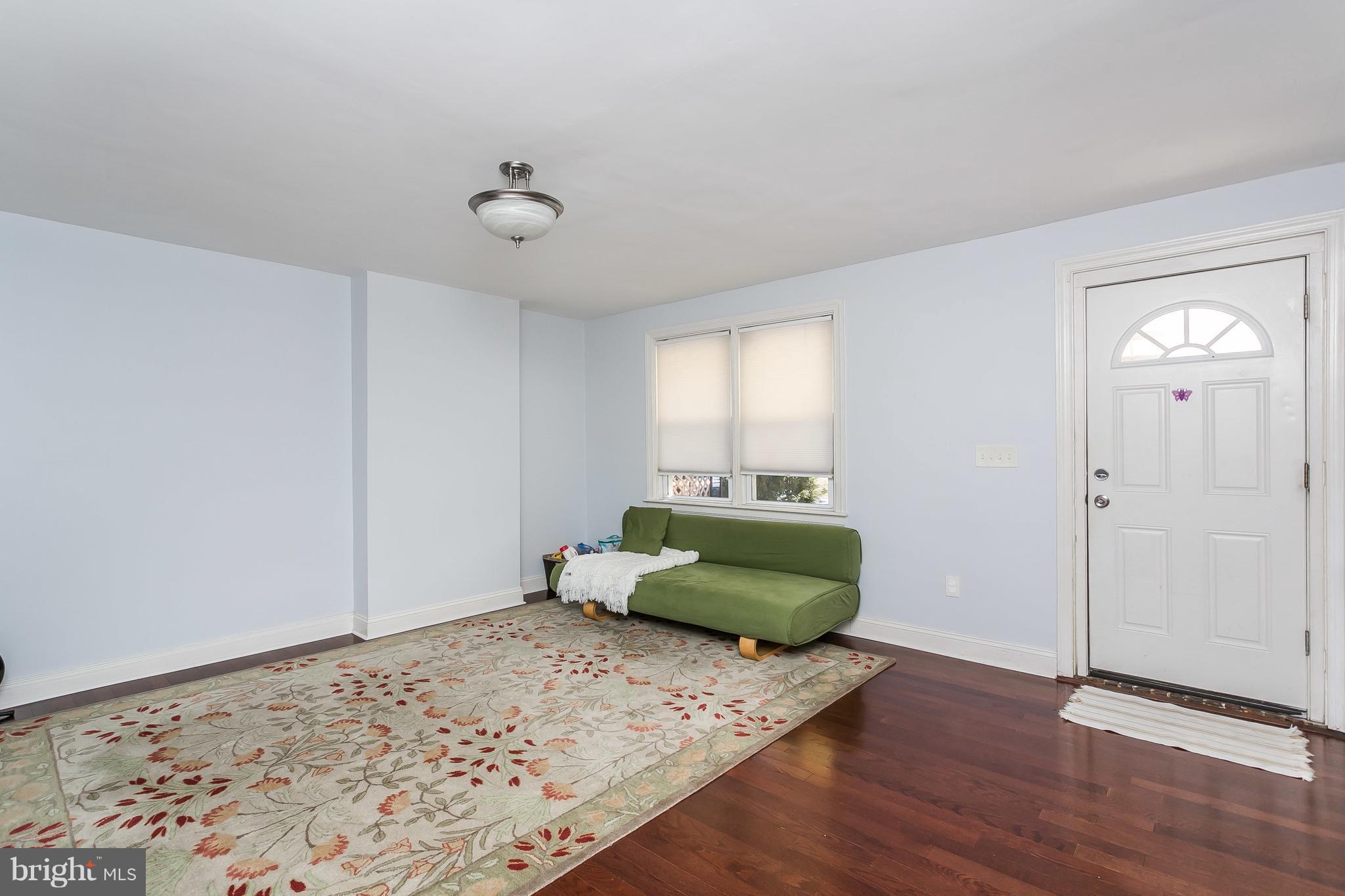 902 Andover Road Baltimore, MD 21218 - Photo 3 of 30 a living room with furniture and a window