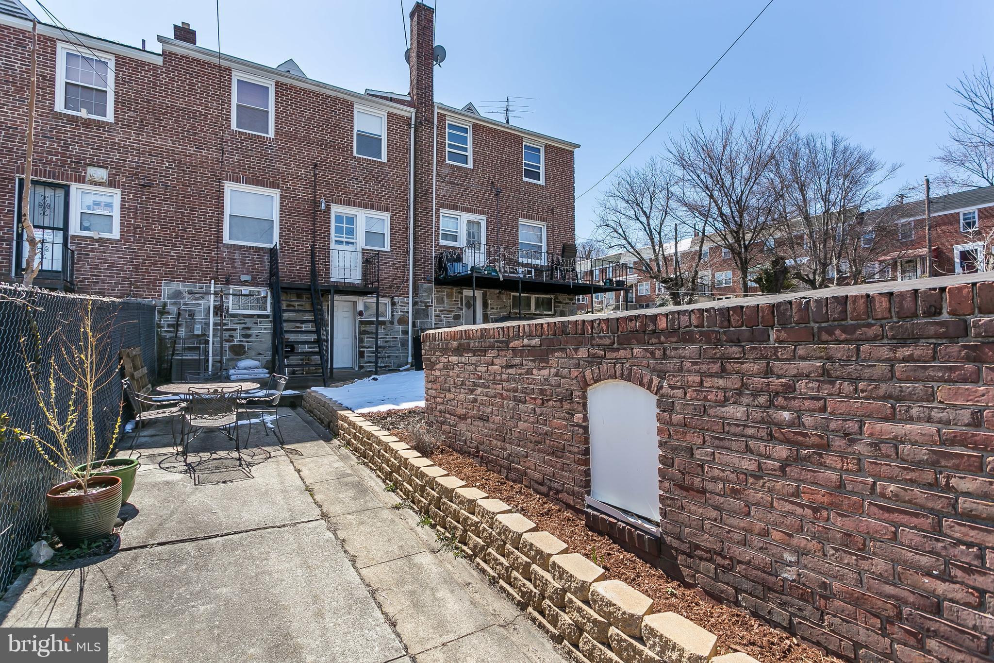 902 Andover Road Baltimore, MD 21218 - Photo 27 of 30 a front view of a house with a yard
