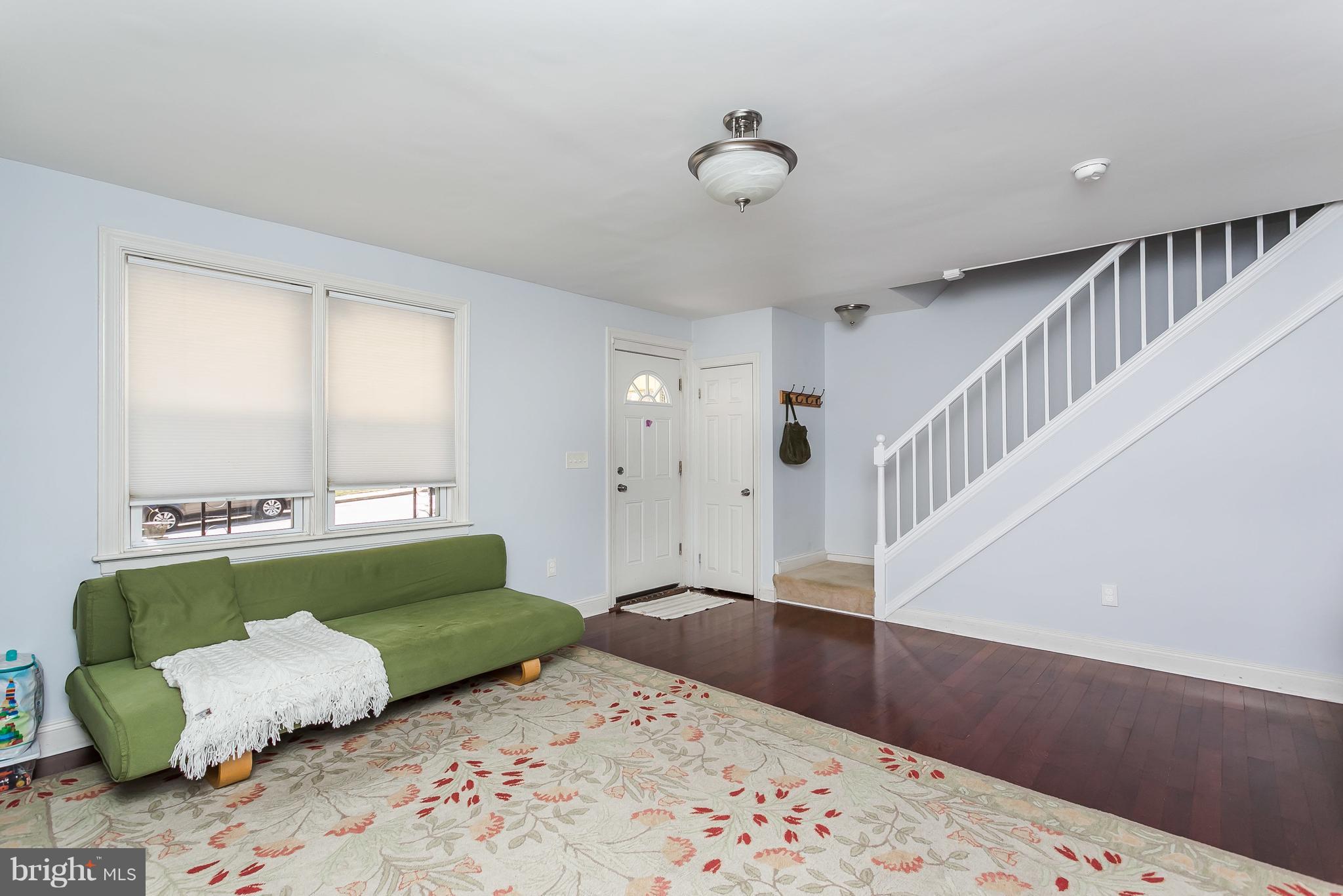 902 Andover Road Baltimore, MD 21218 - Photo 5 of 30 a living room with furniture and a rug
