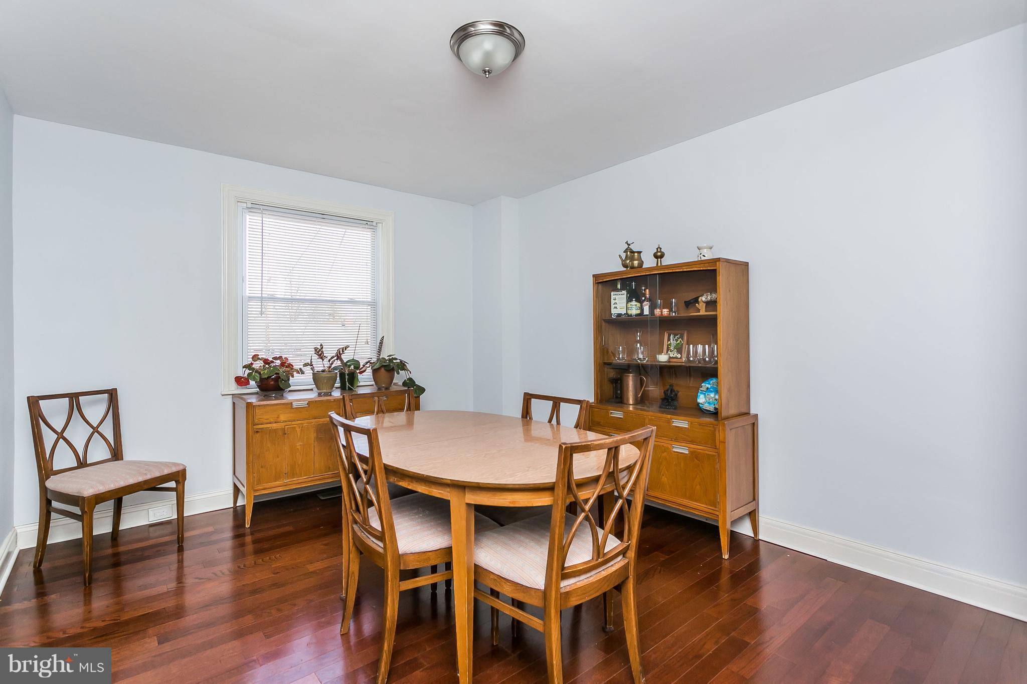 902 Andover Road Baltimore, MD 21218 - Photo 6 of 30 a view of a dining room with furniture and wooden floor