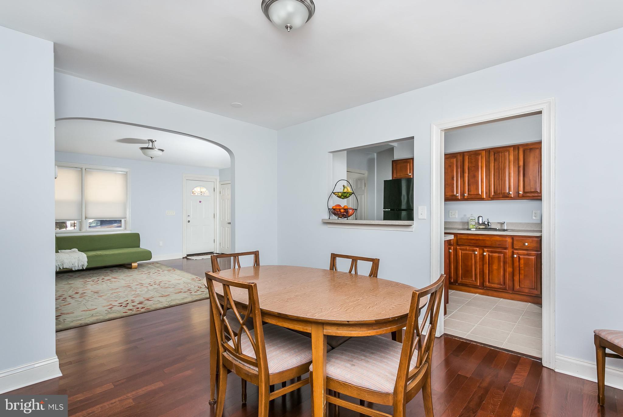 902 Andover Road Baltimore, MD 21218 - Photo 7 of 30 a view of a dining room with furniture and wooden floor