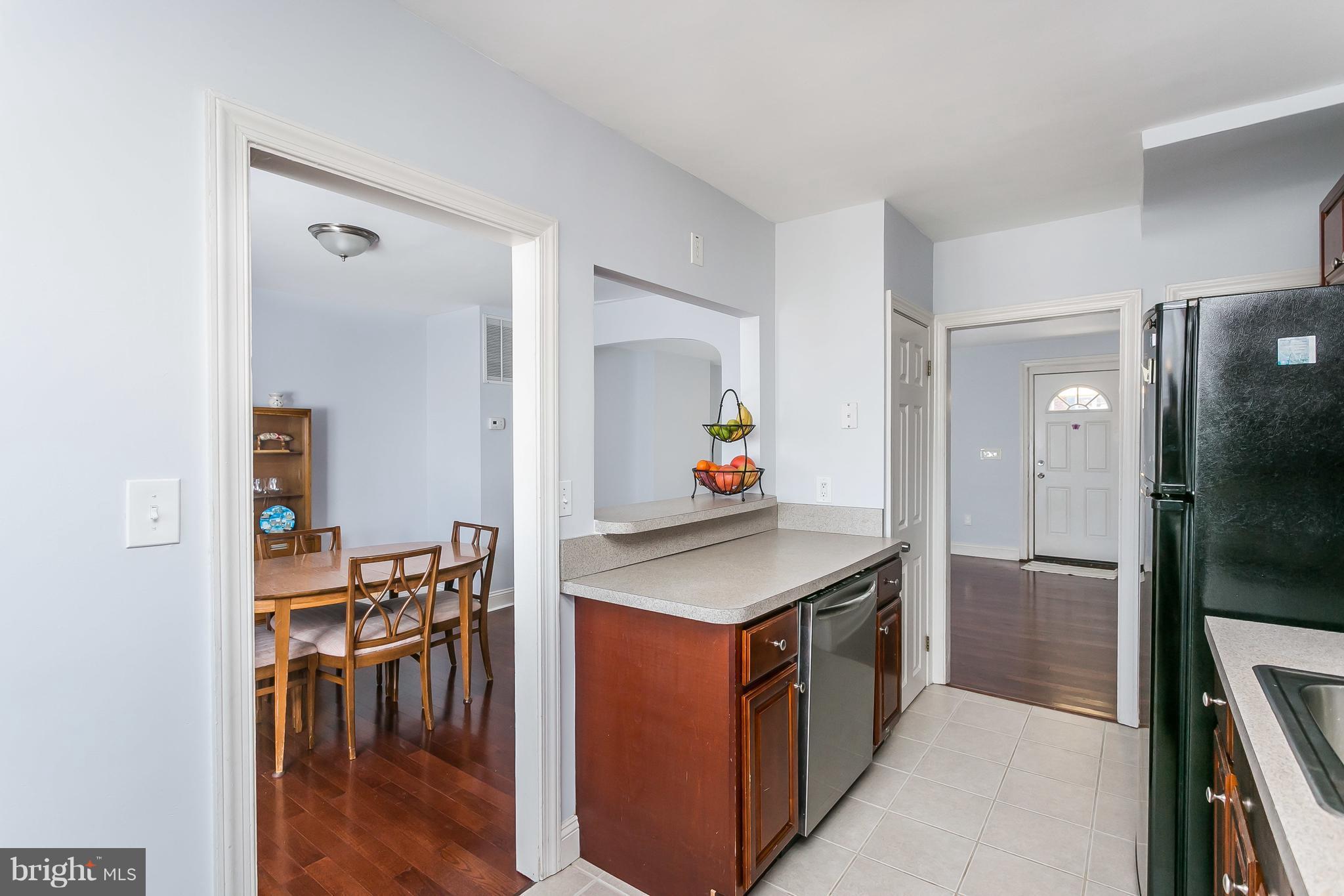 902 Andover Road Baltimore, MD 21218 - Photo 10 of 30 a kitchen with stainless steel appliances granite countertop a stove and a refrigerator