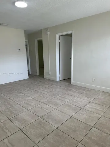 an empty room with a fireplace