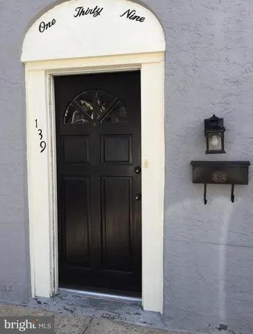 a view of entryway with wooden floor