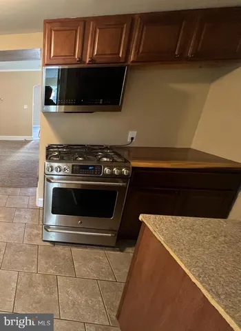 a kitchen with a stove and a microwave