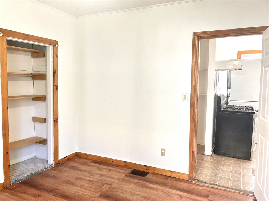 4 Sisson Terrace, Unit 1 Lynn, MA 01902 - Photo 14 of 16 a view of a room with wooden floor and a window