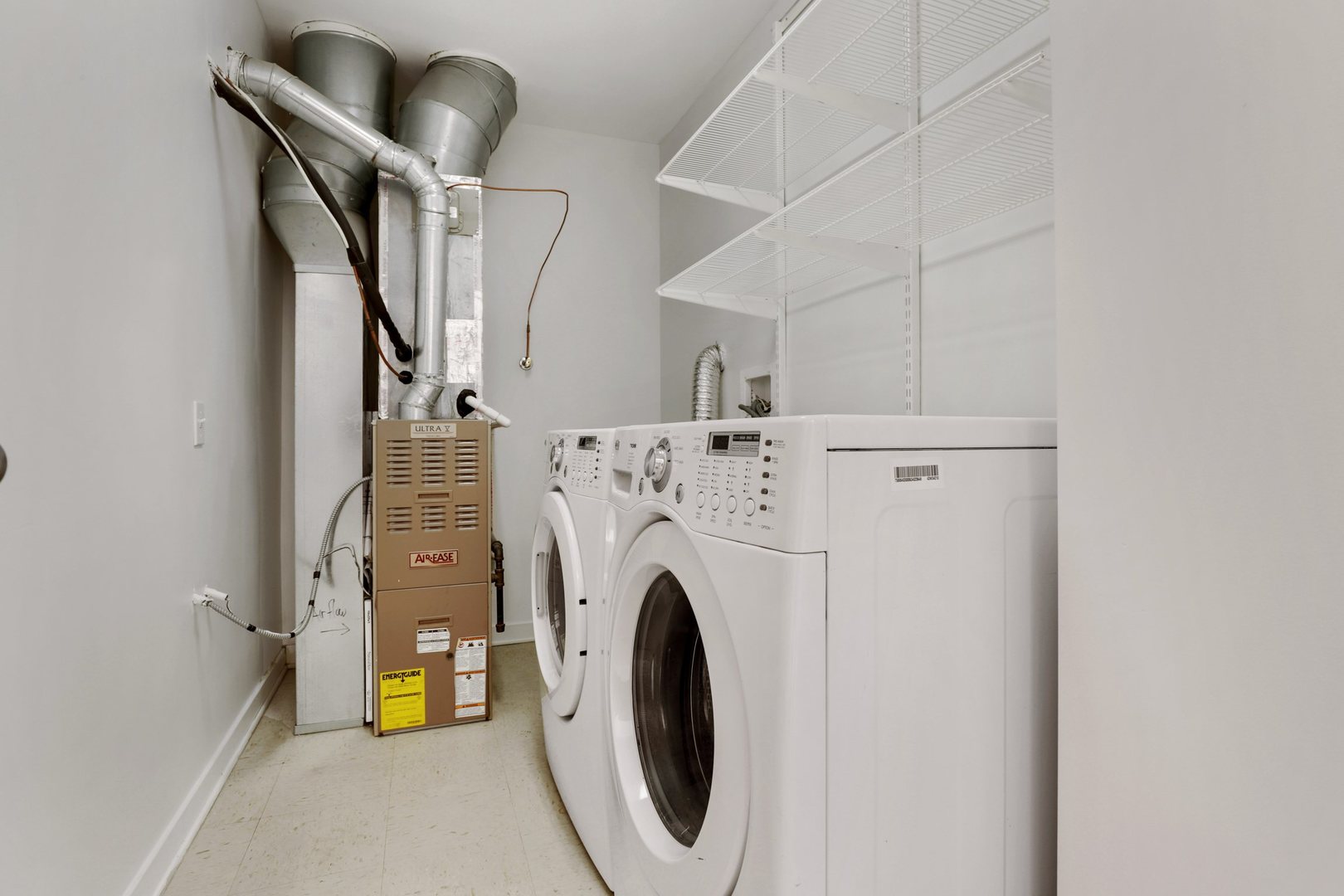 1910 South State Street, Unit 303 Chicago, IL 60616 - Photo 18 of 19 a view of a storage & utility room with washer and dryer