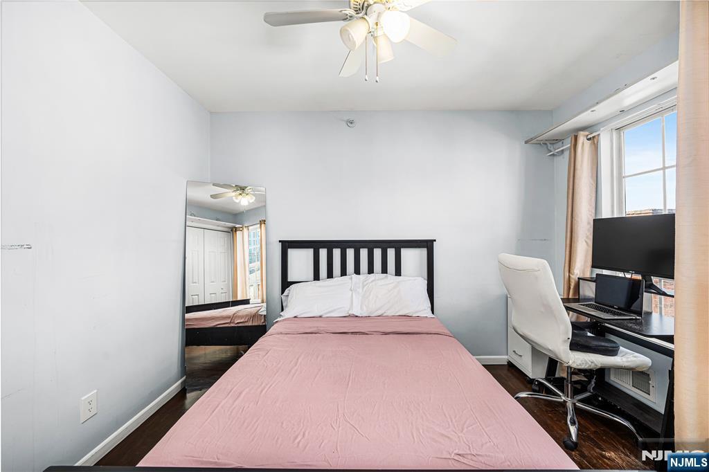 84 Union Street Newark, NJ 07105 - Photo 28 of 39 a bedroom with a bed and a flat screen tv