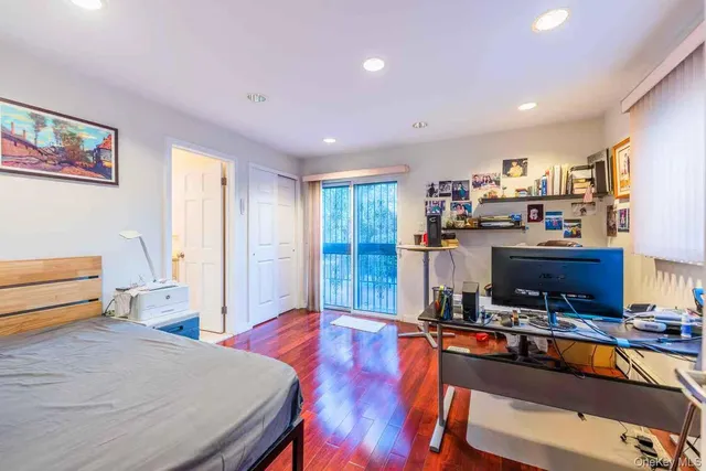 a bedroom with furniture and a window