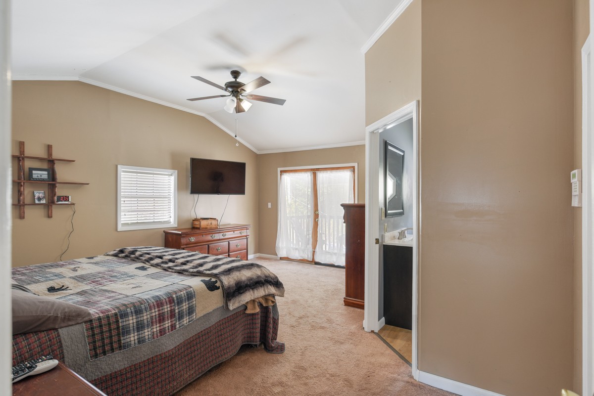 1840 Garrison Branch Road Cottontown, TN 37048 - Photo 15 of 41 Main Bedroom features a vaulted ceiling with fan, TV hookups and a full bath!