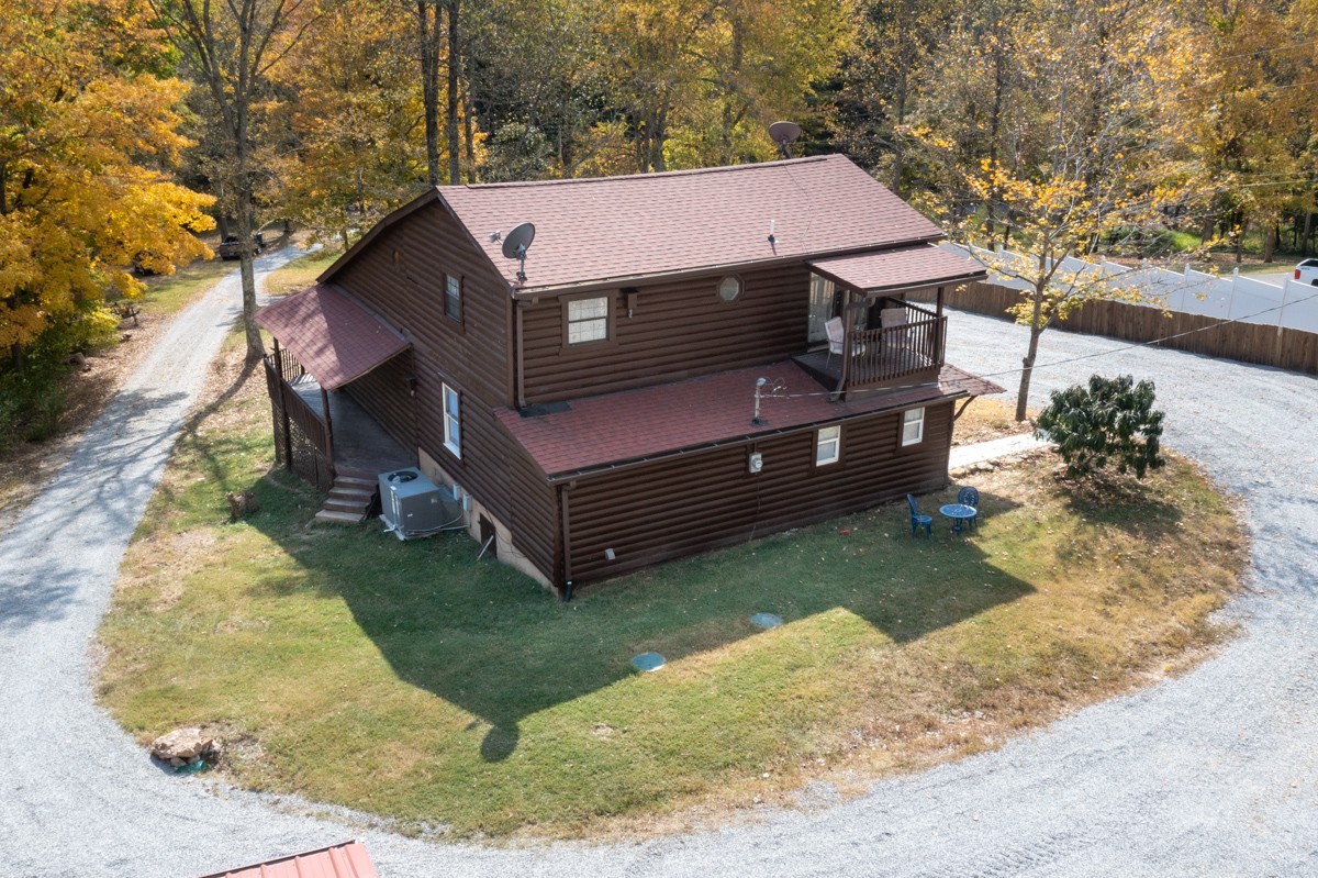 1840 Garrison Branch Road Cottontown, TN 37048 - Photo 26 of 41 Arial view features nice roof, driveway that goes completely around the house, perfect for camping or work trailers, equipment, buses, etc.
