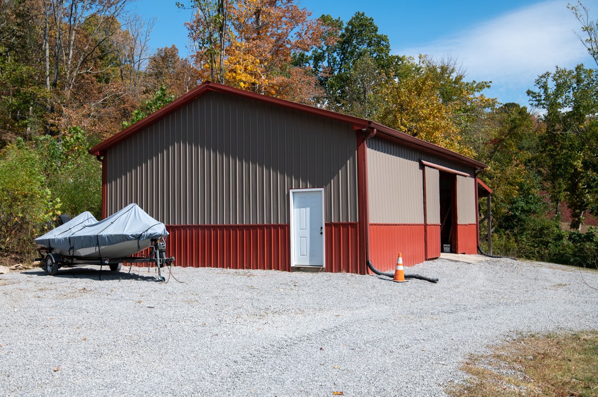 1840 Garrison Branch Road Cottontown, TN 37048 - Photo 27 of 41 Workshop, Garage, storage - this great building is 30x40 and has sliding door and pedestrian door.