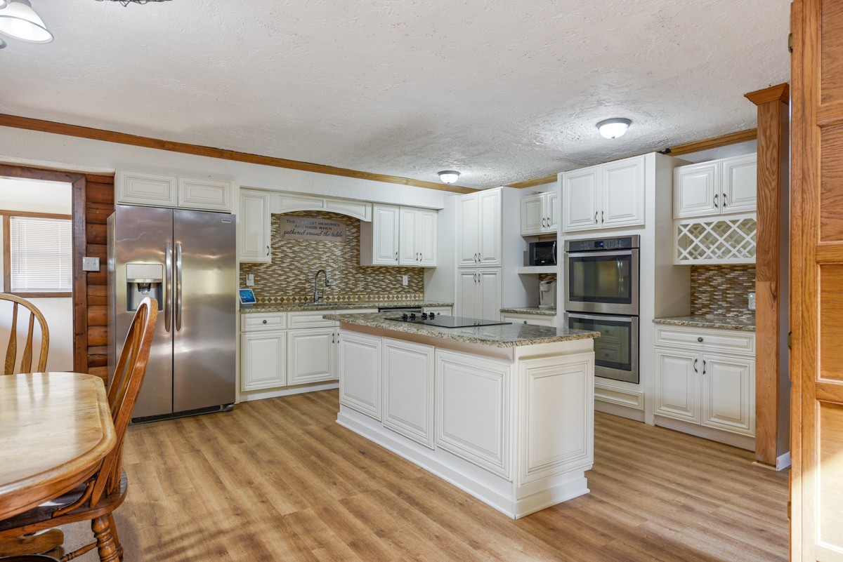 1840 Garrison Branch Road Cottontown, TN 37048 - Photo 5 of 41 BEAUTIFUL kitchen with island, new backsplash & LVP flooring,