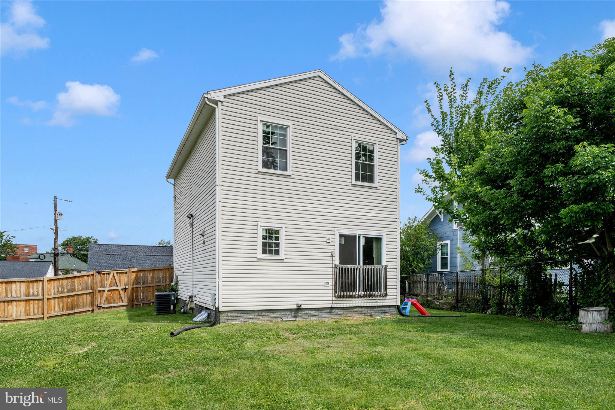713 Seek Lane Silver Spring, MD 20912 - Photo 47 of 60 a front view of a house with a garden